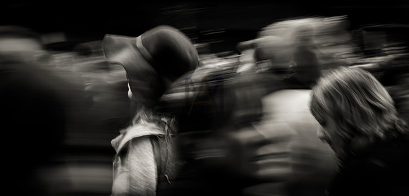 A hat is picked out from the chaos of shopping in Manchester's city centre by Preston based street photographer Alf Myers